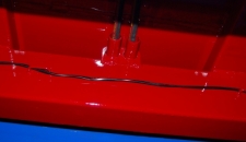 QM Range Hose Set-up - The hoses for the hydraulic door are now run through steel pipes to the underside of the trailer so that they are better protected.