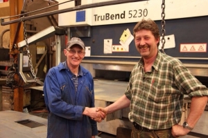 Factory Foreman Clive Woods Shaking Hands With Sandy Singer