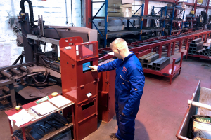 SAP controlled bandsaw in the red zone of the Marshall Trailers factory.